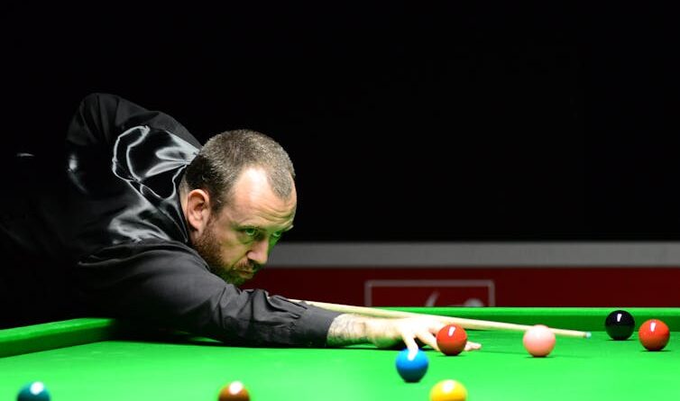 A snooker player, looking up angrily.